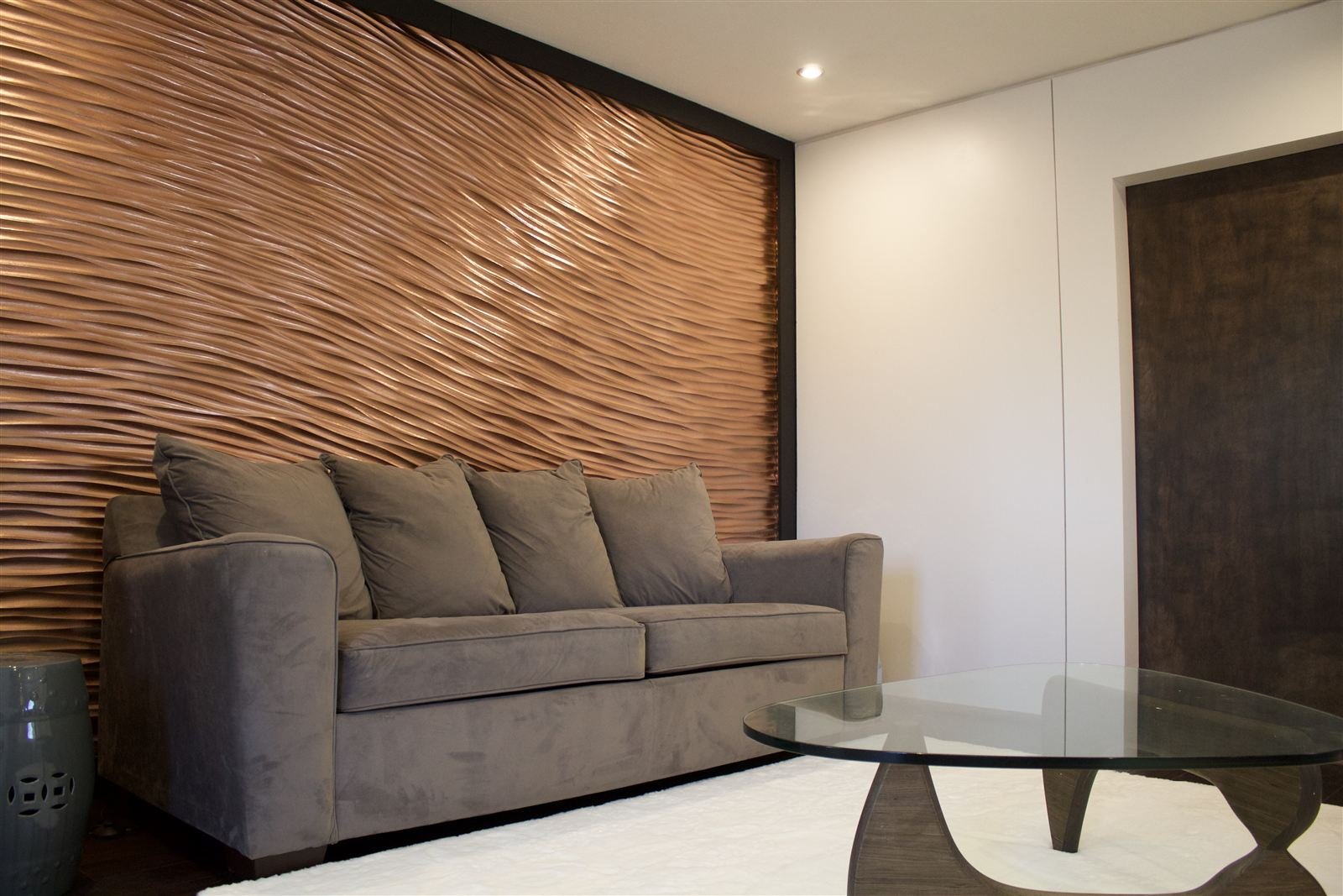 Floating white oak console table with CNC-carved city skyline base
